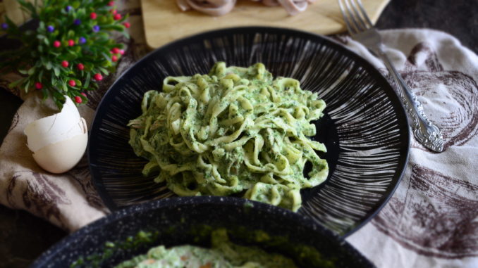 Pasta with duck and creamy spinach sauce